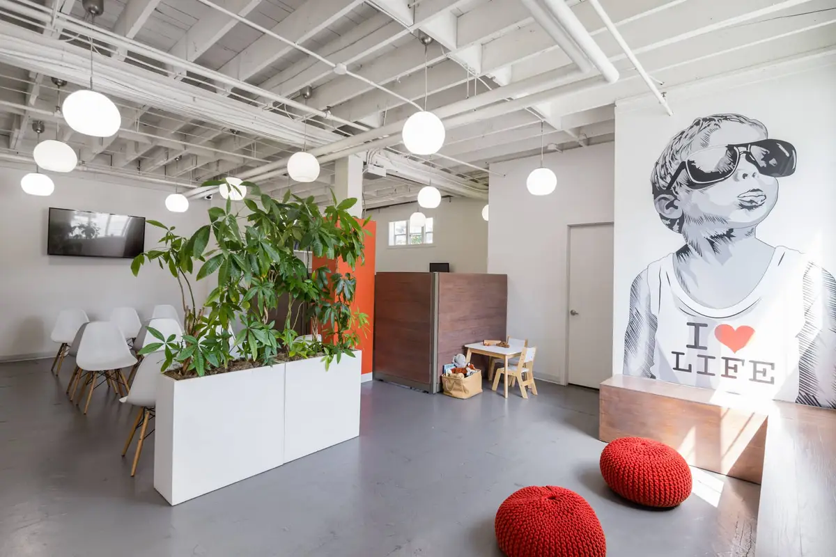 The open reception and waiting area at the Revolution Health chiropractic clinic in Vancouver
